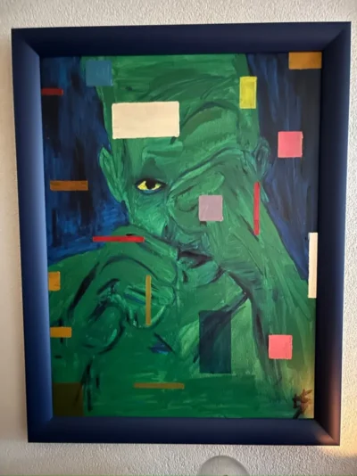 Green portrait in a blue frame