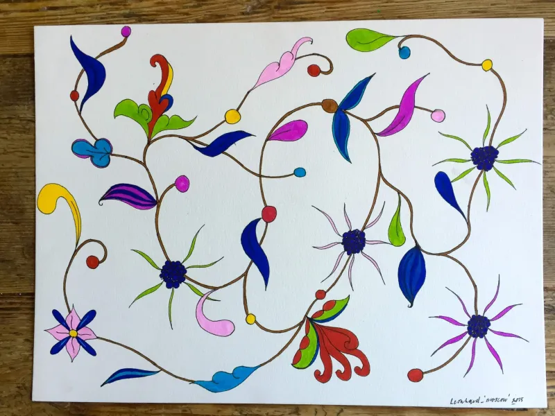 Colourful flower garlands drawn on paper, lying on a wooden table